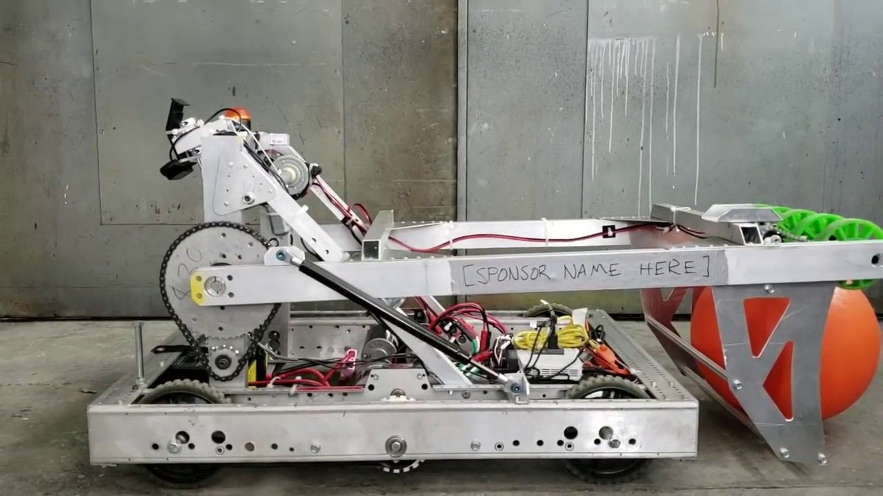A FAMNM Ri3D robot with a piece of tape where 'SPONSOR NAME HERE' is written
